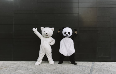 Panda and teddy bear having fun around the city