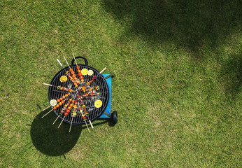 Aerial view of barbecues steaks on the charcoals grill - obrazy, fototapety, plakaty