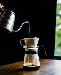 Barista making drip coffee