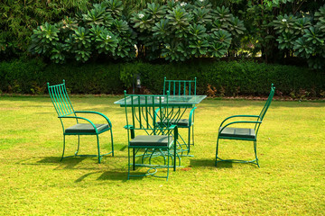 Garden furniture set on lawn on sunny day