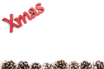 X-mas text and pine cone on white background
