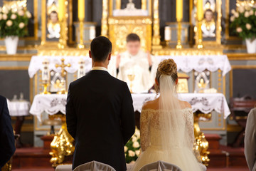Priest celebrate wedding mass at the church - Powered by Adobe