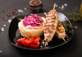 Minced Lula kebab grilled turkey (chicken) with fresh tomato and bulgur