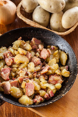 Fried potatoes with onion and bacon