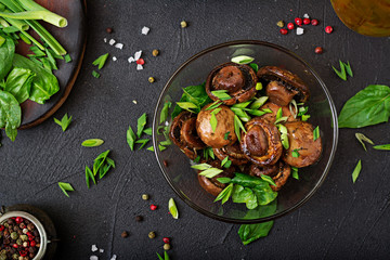 Baked mushrooms with soy sauce and herbs. Top view