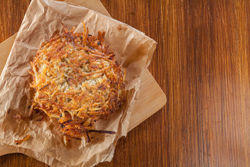 Hash brown, potato pancakes on paper