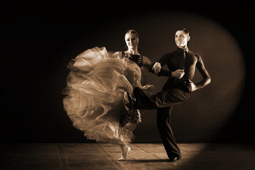 dancers in ballroom isolated on black background
