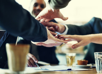 Business people are joining hands together