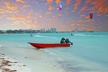 Water sport at Palm Beach on Aruba island at sunset © Nataraj