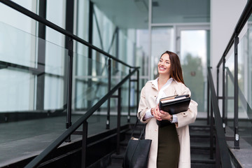 Portrait of young beautiful businesswoman going to office