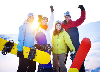 Snowboarders on top of the mountain