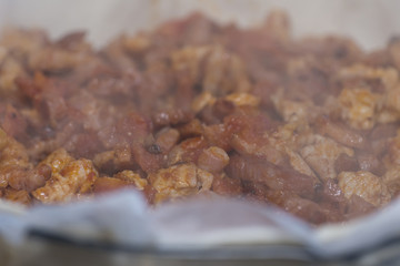 Cooking bacon, tomatoes and chicken