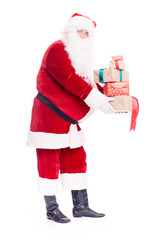 Isolated portrait of Santa Claus holding heap of Christmas gift boxes