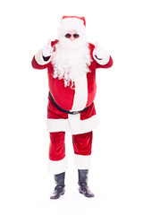 Portrait of cool Santa Claus in traditional costume wearing sunglasses on white background