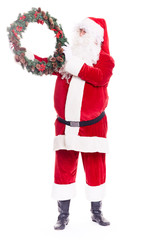 Portrait of Santa Claus in traditional costume holding Christmas wreath