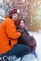 Christmas Background - Winter lifestyle consept - loving couple have fun in the park - Healthy lifestyle - Happy peopleg Snowflakes - Sunny day - Happy Family