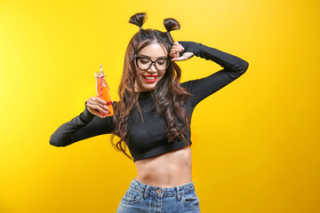 Beautiful hipster girl on yellow background