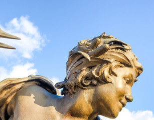 Statues of angels on the bridge of Paris in France "Pont Alexandre III"