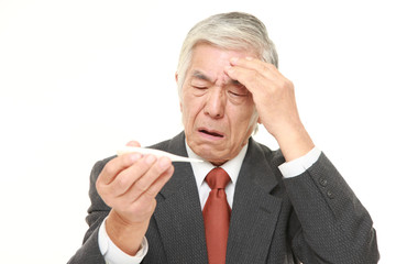 senior Japanese businessman with fever