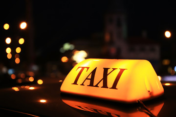 Taxi roof top light at night, closeup