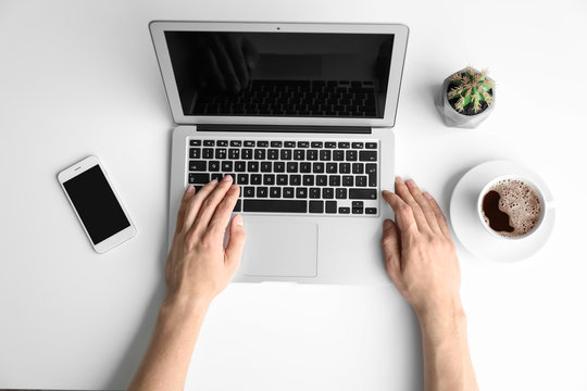 Man using laptop on table, top view