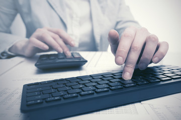 Financial accounting Business woman using computer keyboard