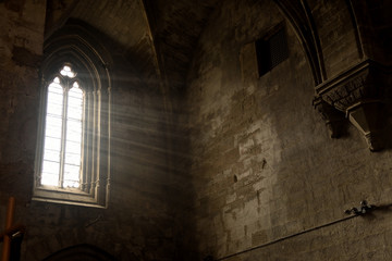 Fototapeta premium lightning that enters through the window of the monastery of Vallbona de les Monges, Lleida province,Spain