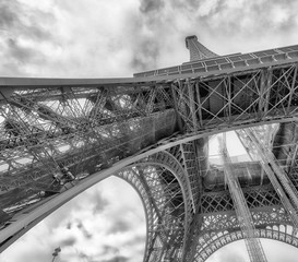 Skyward view of Eiffel Tower on a cloudy winter day - France