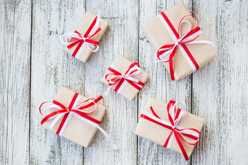 Top view of gift box wrapped in craft paper with ribbon bow