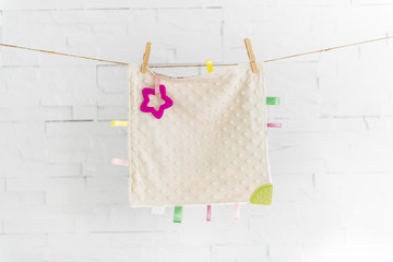 knitted blanket for a baby child on washing line