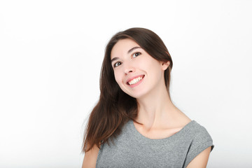 Excited happy looking woman. Closeup of happy mixed race asian caucasian female model isolated on white background.