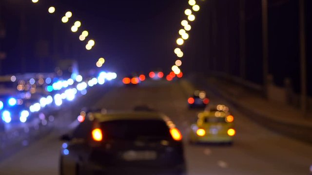Cars driving up on a bridge. Cars on an overpass. Defocused background