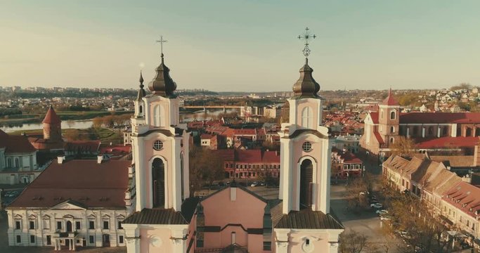 Aerial. Smooth drone shot around Church of St. Francis Xavier and Town Hall above square in downtown, Kaunas, Lithuania. Spring (colour grade)