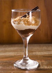 Italian dessert tiramisu in glass with peanut, sweet food