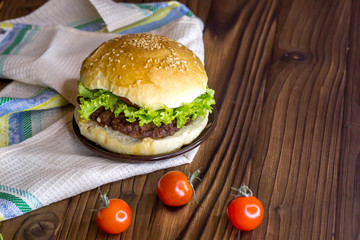 Fresh hamburger on the table. Eating lunch. Fast food