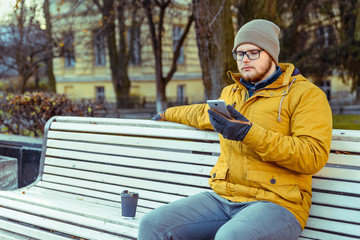 Fototapeta premium man waiting outside and drinking coffe