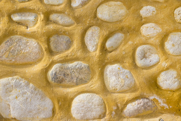 Stone old wall background with large-sized stones close-up
