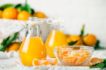 Fresh tangerines and tangerine juice. Healthy food, Selective focus.