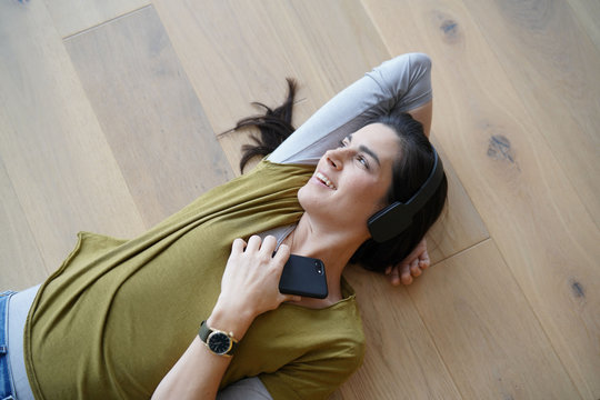 Woman listening to music with bluetooth headset