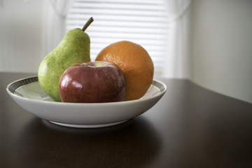Three fruit in a bowl