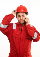 Young builder worker in red hardhat
