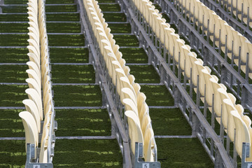 Obraz premium Rows of plastic chairs for spectators in the stands