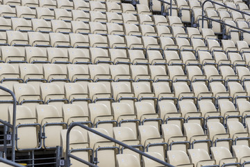 Rows of plastic chairs for spectators in the stands