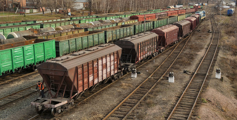 Freight wagons on railway station. Cargo terminal. Industrial background. Kazakhstan...