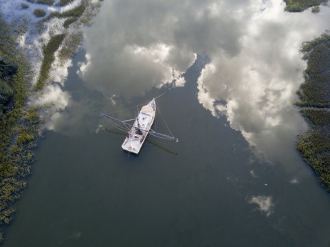 Aerial view of shrimp boat in South Carolina with perfect reflection