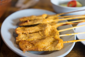 Pork Satay and sauce in plate on table