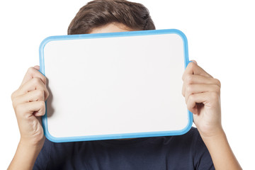 Naklejka premium young boy holding whiteboard