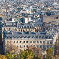 Fototapeta na wymiar Paris, beautiful Haussmann facades and roofs in a attractive area of the capital, view from the triumph arch 