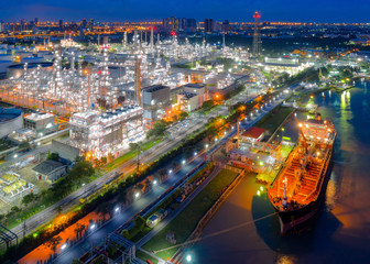 Aerial view of twilight of oil refinery ,Shot from drone of Oil refinery and Petrochemical plant at dusk , Bangkok, Thailand