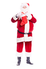 Portrait of Santa Claus hiding gift box into Christmas stocking on white background